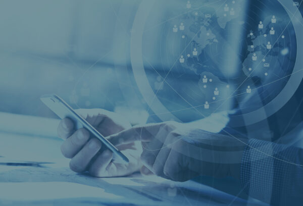 Business concept. Businessman working generic design laptop. Touching screen smartphone. Worldwide connection technology interface. Horizontal closeup